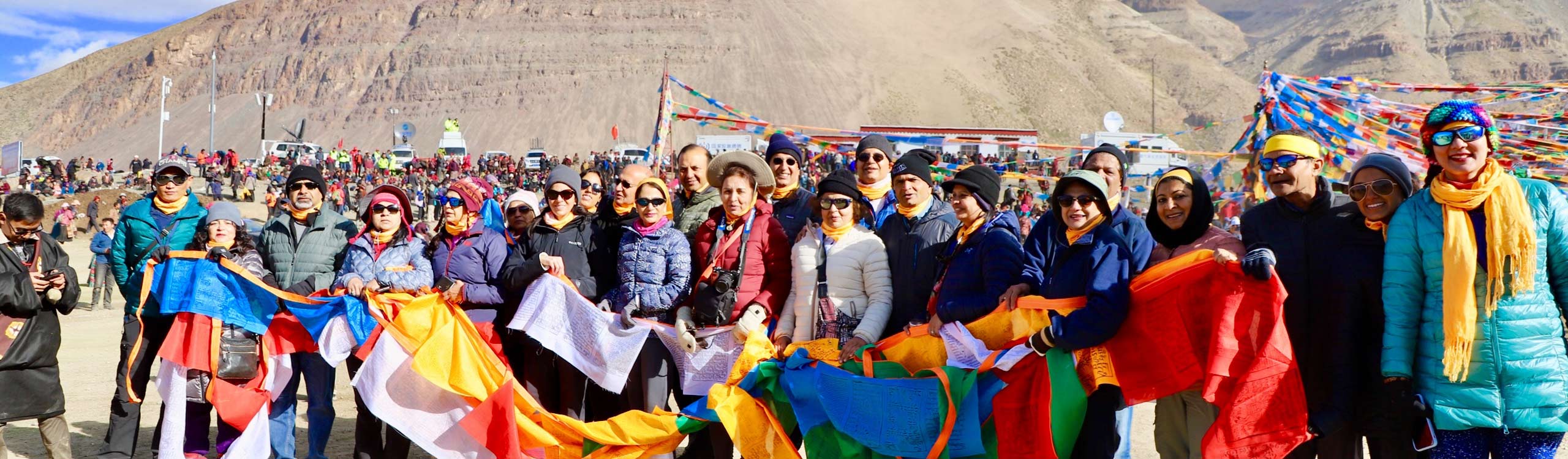 Hanging prayer flags before Mount Kailash kora trekking